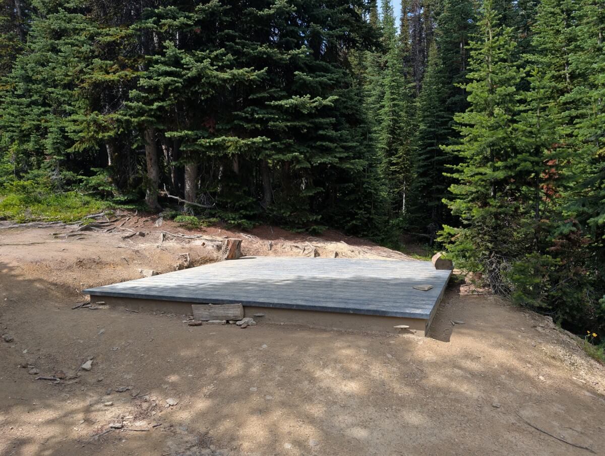 Plastic lumber tent platform at Snowball campground, in cleared space in forest
