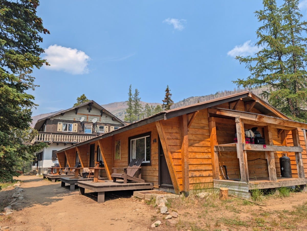 Side view of newer cabin building at Cathedral Lakes Lodge, with two storey 1970s building in background