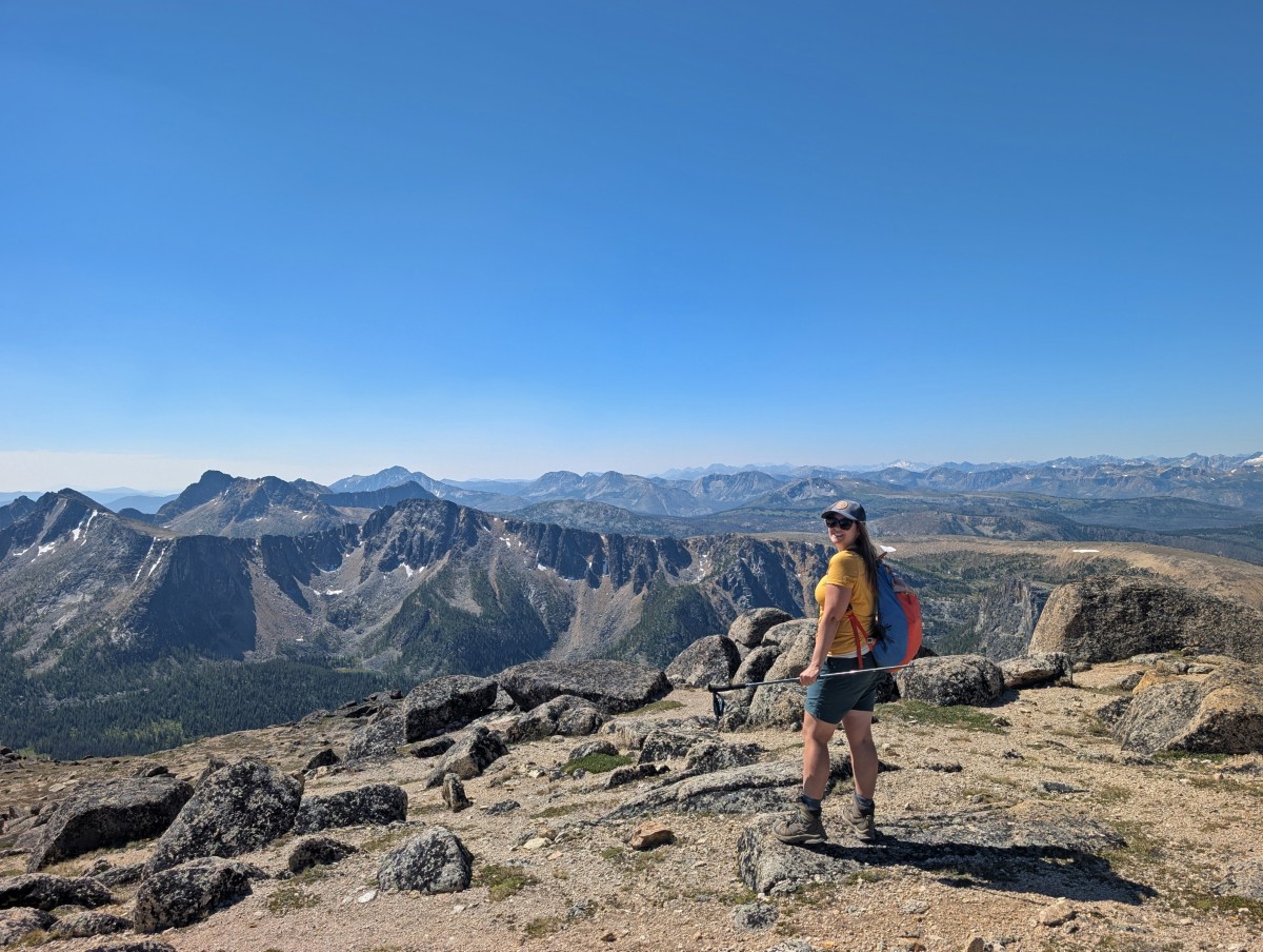 Back view of Gemma with backpack in front of big mountain views on the Rim Trail, Cathedral Provincial Park